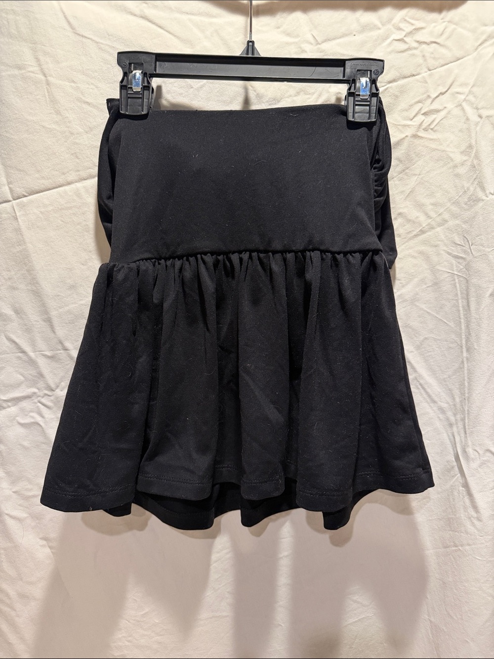 Susana Monaco Black Flared Tunic Top. Tie back.